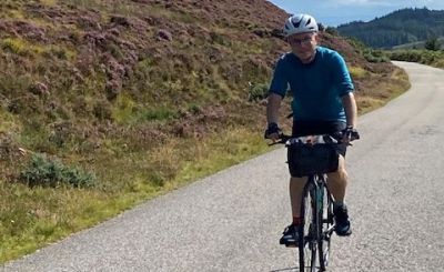 Duncan Squire Cycling on the  tour with redspokes